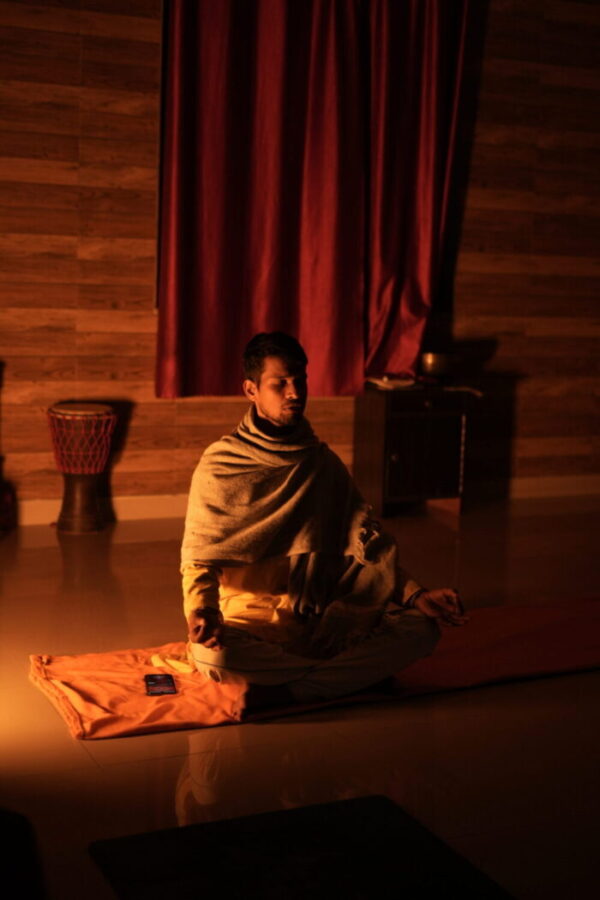 A teacher guiding a breathwork session