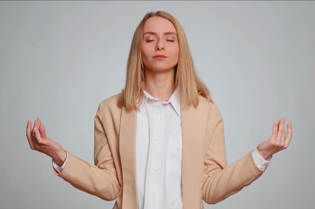A student practicing a gentle eye relaxation technique