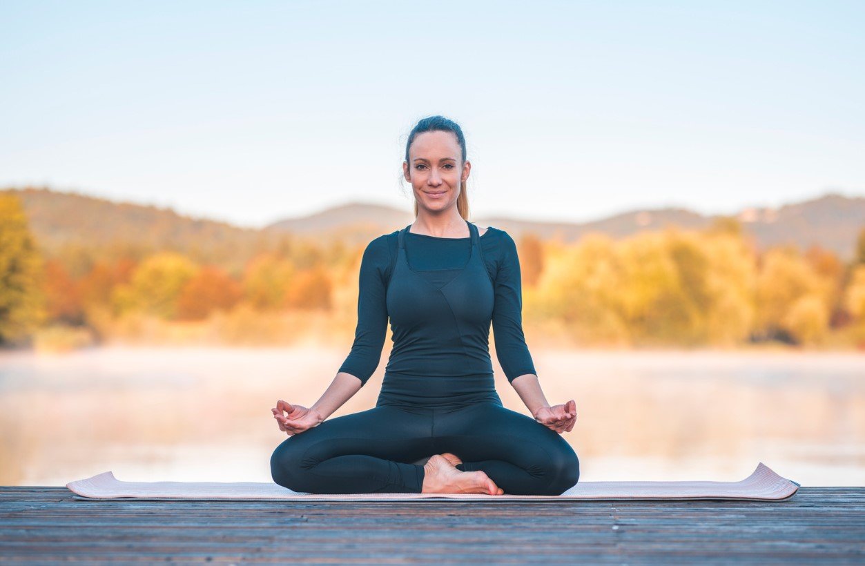 A student seated in meditation, cultivating awareness of the pelvic floor for Moola Bandha